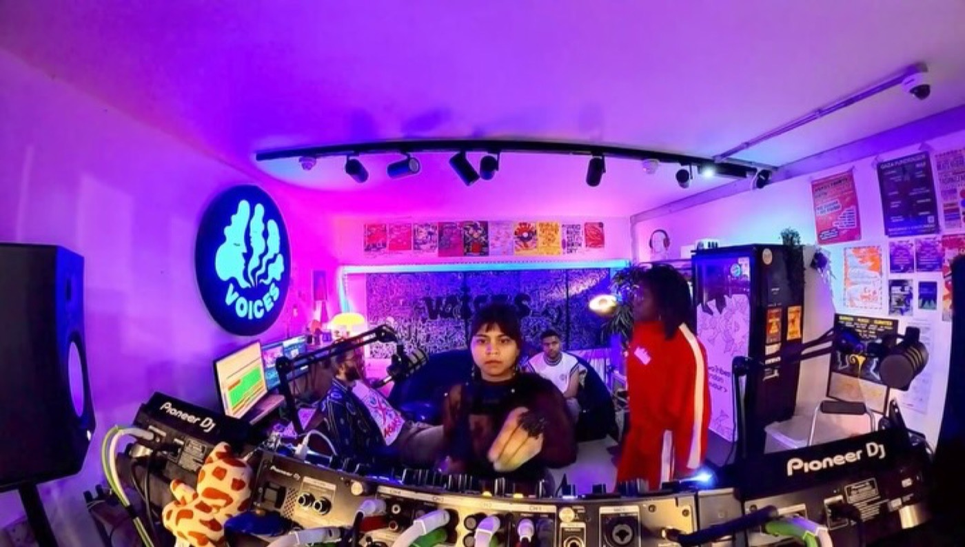 Prerna Singh playing a set in the UV-lit Voices Radio booth